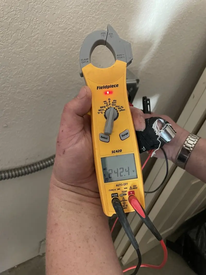 Voltage testing with clamp meter during Circuit Breaker Repair in Burlington